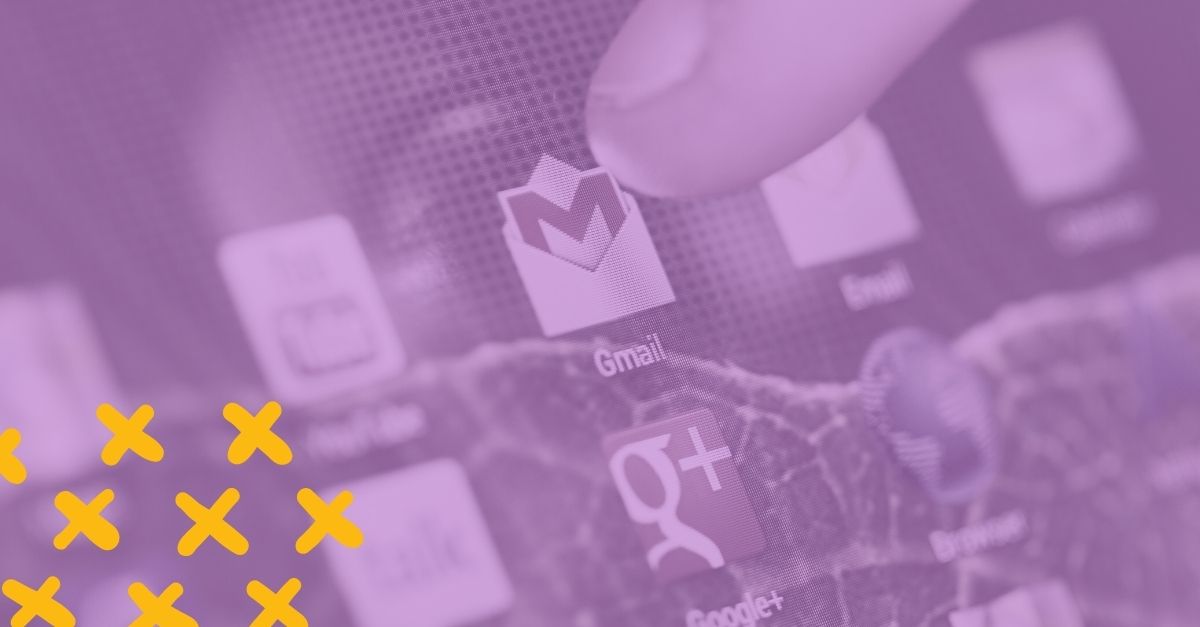 finger tapping the gmail app icon on a screen