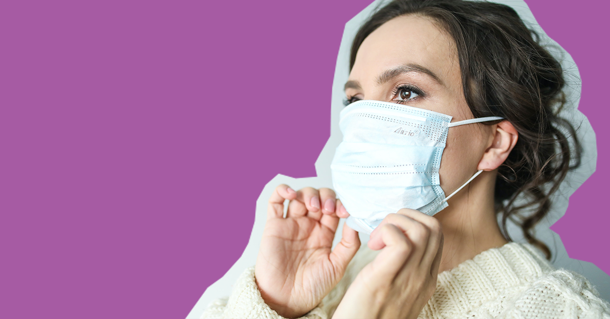 Woman putting on a mask